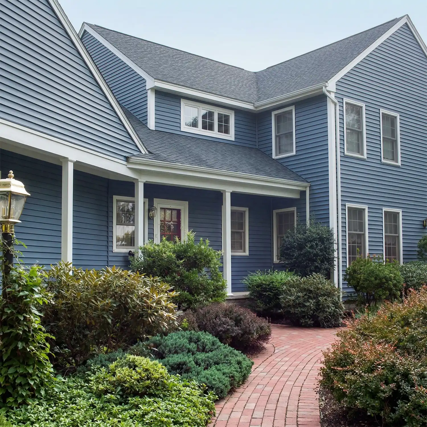 house with new blue siding and roofing